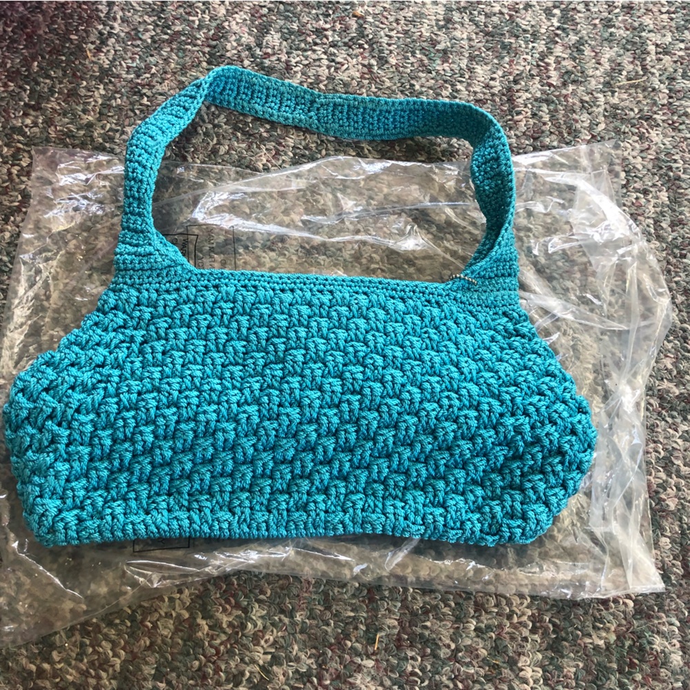 The Sak, teal crocheted hand bag.